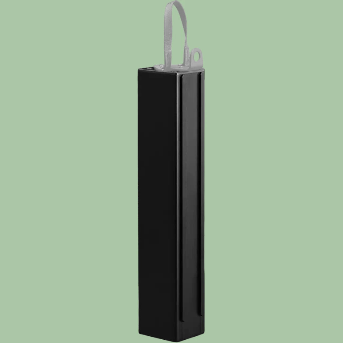 Black rectangular object with a handle on a light green background